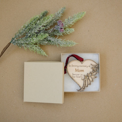 Personalized memorial ornament in loving memory of Mom. Thoughtfully crafted, this special keepsake beautifully honors her enduring love and legacy, offering a heartfelt remembrance during the holiday season.