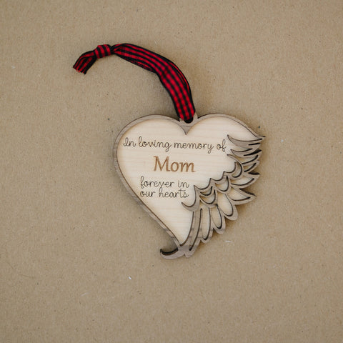 Personalized memorial ornament in loving memory of Mom. Thoughtfully crafted, this special keepsake beautifully honors her enduring love and legacy, offering a heartfelt remembrance during the holiday season.