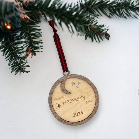 Slumber in serenity with our Sleep in Heavenly Peace Wooden Ornament. Crafted with care, this ornament brings the tranquility of a peaceful night's sleep to your holiday decor. Embrace the warmth and comfort of the season with this timeless addition to your tree