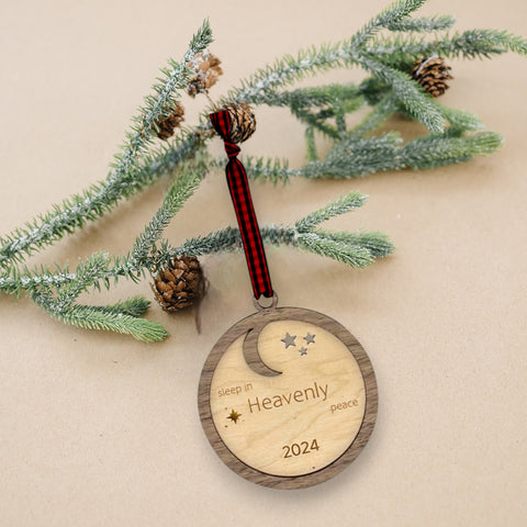 Slumber in serenity with our Sleep in Heavenly Peace Wooden Ornament. Crafted with care, this ornament brings the tranquility of a peaceful night's sleep to your holiday decor. Embrace the warmth and comfort of the season with this timeless addition to your tree