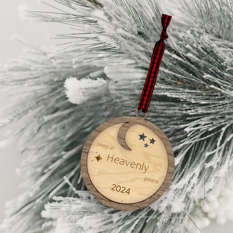 Slumber in serenity with our Sleep in Heavenly Peace Wooden Ornament. Crafted with care, this ornament brings the tranquility of a peaceful night's sleep to your holiday decor. Embrace the warmth and comfort of the season with this timeless addition to your tree