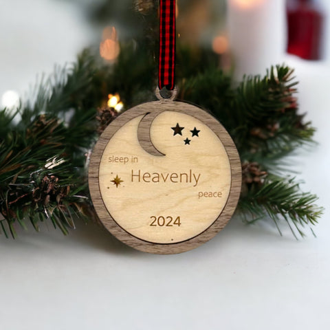 Slumber in serenity with our Sleep in Heavenly Peace Wooden Ornament. Crafted with care, this ornament brings the tranquility of a peaceful night's sleep to your holiday decor. Embrace the warmth and comfort of the season with this timeless addition to your tree