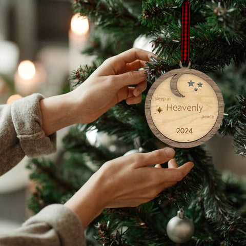 Slumber in serenity with our Sleep in Heavenly Peace Wooden Ornament. Crafted with care, this ornament brings the tranquility of a peaceful night's sleep to your holiday decor. Embrace the warmth and comfort of the season with this timeless addition to your tree