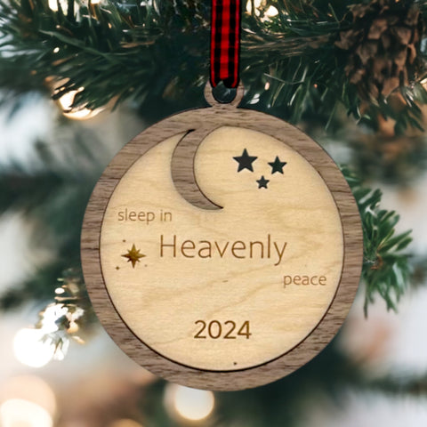 Slumber in serenity with our Sleep in Heavenly Peace Wooden Ornament. Crafted with care, this ornament brings the tranquility of a peaceful night's sleep to your holiday decor. Embrace the warmth and comfort of the season with this timeless addition to your tree