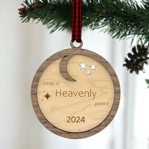 Slumber in serenity with our Sleep in Heavenly Peace Wooden Ornament. Crafted with care, this ornament brings the tranquility of a peaceful night's sleep to your holiday decor. Embrace the warmth and comfort of the season with this timeless addition to your tree
