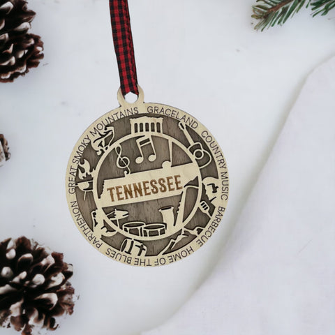 Celebrate the Volunteer State with our Tennessee State Highlights Ornament! A miniature masterpiece capturing the heart and soul of Tennessee's charm. Elevate your holiday decor with a touch of southern warmth.