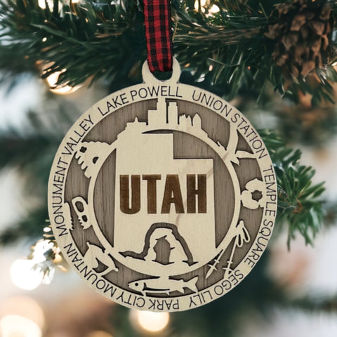 Elevate your holiday decor with the Utah State Highlights Ornament! A stunning tribute to the Beehive State's natural wonders and vibrant spirit. Bring home a piece of Utah's beauty this festive season.