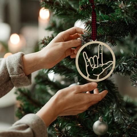 Elegant ASL (American Sign Language) 'I Love You' ornament, a beautiful symbol of love and inclusivity. Celebrate the spirit of connection and communication with this heartfelt decoration, perfect for the holiday season and beyond.