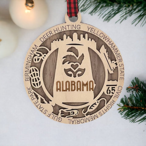 An intricately crafted Alabama State Highlights Ornament featuring iconic landmarks and symbols, showcasing the rich heritage and vibrant culture of the Heart of Dixie.