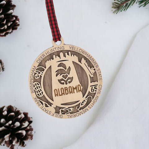 An intricately crafted Alabama State Highlights Ornament featuring iconic landmarks and symbols, showcasing the rich heritage and vibrant culture of the Heart of Dixie.