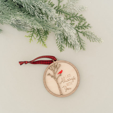 Cardinal memorial wooden ornament, adorned with the heartfelt phrase 'I am always with you,' creating a touching tribute to celebrate everlasting love and cherished memories. The ornament can be personalized on the back with any name or phrase.