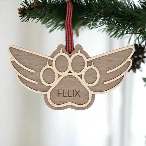 Pay tribute to your beloved feline friend with this personalized cat paw memorial ornament. Add your cat's name for a touching keepsake, celebrating their enduring spirit during the holiday season.