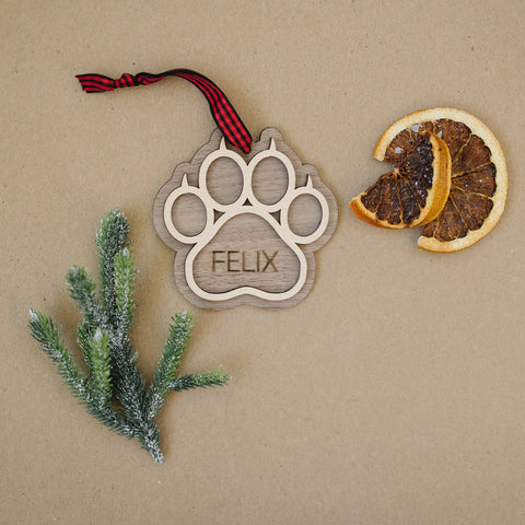 Sweet and Personalized Cat Paw Ornament - Adorn your tree with this delightful ornament featuring a cute cat paw print. Customize it with your cat's name for a unique touch, celebrating the feline charm that brightens your holiday season