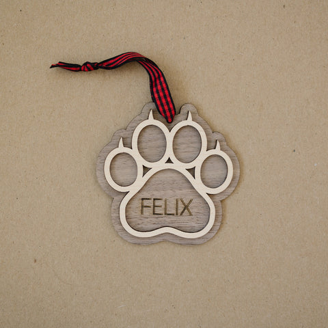 Sweet and Personalized Cat Paw Ornament - Adorn your tree with this delightful ornament featuring a cute cat paw print. Customize it with your cat's name for a unique touch, celebrating the feline charm that brightens your holiday season