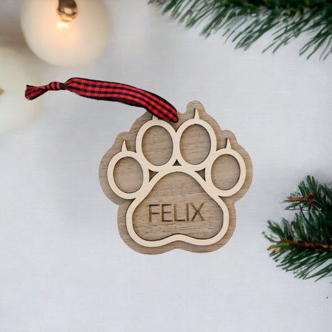 Sweet and Personalized Cat Paw Ornament - Adorn your tree with this delightful ornament featuring a cute cat paw print. Customize it with your cat's name for a unique touch, celebrating the feline charm that brightens your holiday season