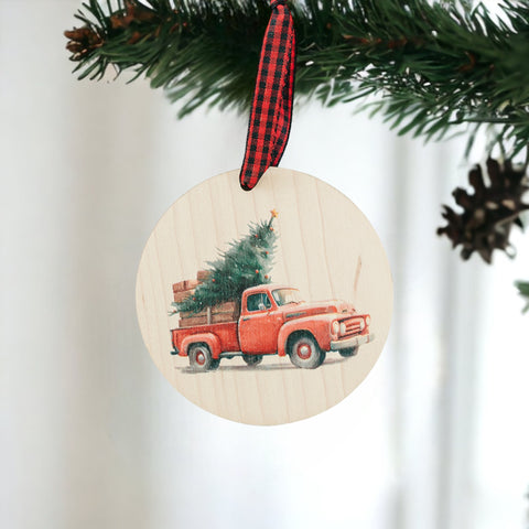 Charming Christmas tree truck ornament, capturing the festive spirit of the season. Adorned with a nostalgic truck hauling a beautifully decorated tree, this delightful ornament adds a touch of holiday magic to your decorations.