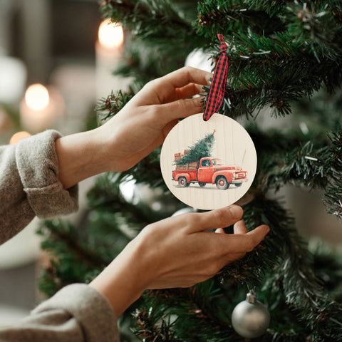 Charming Christmas tree truck ornament, capturing the festive spirit of the season. Adorned with a nostalgic truck hauling a beautifully decorated tree, this delightful ornament adds a touch of holiday magic to your decorations.