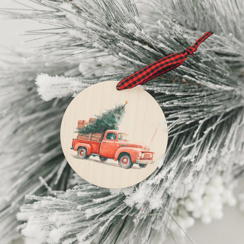 Charming Christmas tree truck ornament, capturing the festive spirit of the season. Adorned with a nostalgic truck hauling a beautifully decorated tree, this delightful ornament adds a touch of holiday magic to your decorations.