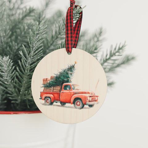 Charming Christmas tree truck ornament, capturing the festive spirit of the season. Adorned with a nostalgic truck hauling a beautifully decorated tree, this delightful ornament adds a touch of holiday magic to your decorations.