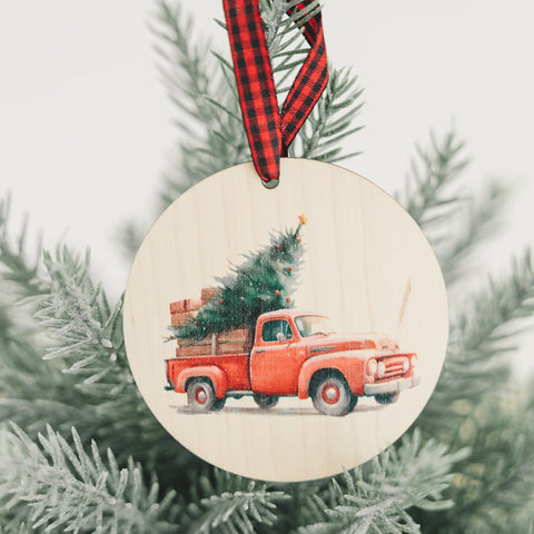 Charming Christmas tree truck ornament, capturing the festive spirit of the season. Adorned with a nostalgic truck hauling a beautifully decorated tree, this delightful ornament adds a touch of holiday magic to your decorations.