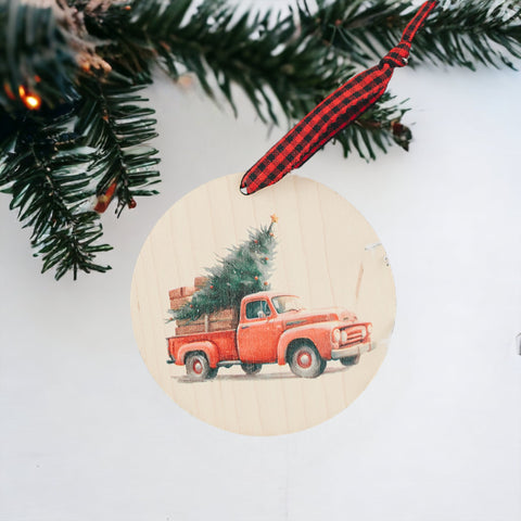 Charming Christmas tree truck ornament, capturing the festive spirit of the season. Adorned with a nostalgic truck hauling a beautifully decorated tree, this delightful ornament adds a touch of holiday magic to your decorations.