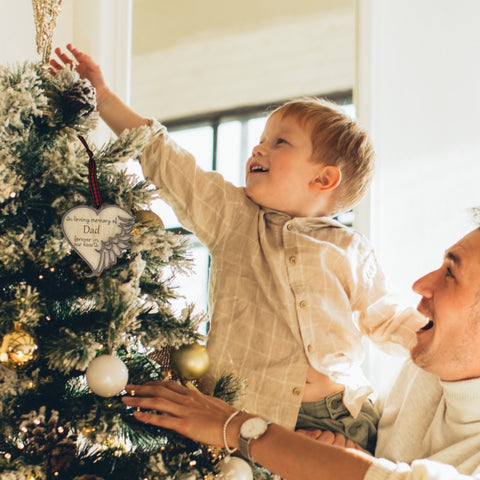 Customized memorial ornament, a touching tribute to Dad. Crafted with care, this personalized keepsake captures the essence of his love and enduring presence, offering a meaningful remembrance during the holiday season.