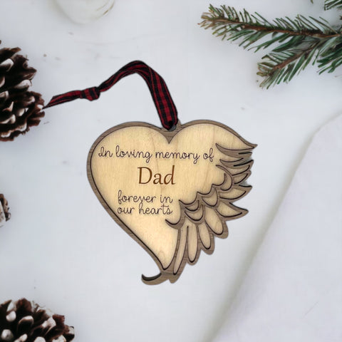 Customized memorial ornament, a touching tribute to Dad. Crafted with care, this personalized keepsake captures the essence of his love and enduring presence, offering a meaningful remembrance during the holiday season.