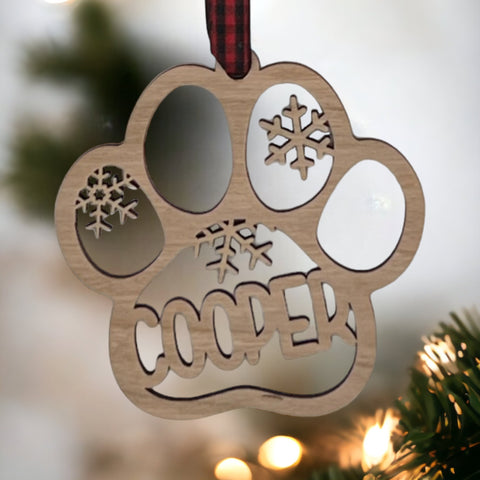 Capture your furry friend's spirit with the Dog Paw Print Personalized Ornament. Add a custom touch by imprinting your dog's name, creating a heartfelt keepsake for your holiday celebrations