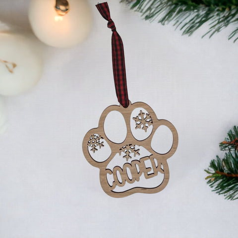 Capture your furry friend's spirit with the Dog Paw Print Personalized Ornament. Add a custom touch by imprinting your dog's name, creating a heartfelt keepsake for your holiday celebrations