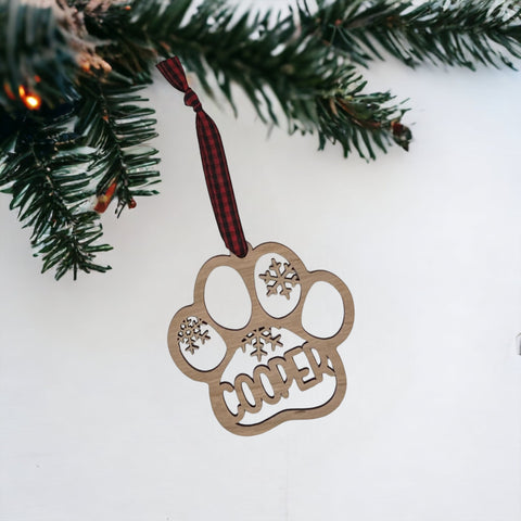 Capture your furry friend's spirit with the Dog Paw Print Personalized Ornament. Add a custom touch by imprinting your dog's name, creating a heartfelt keepsake for your holiday celebrations