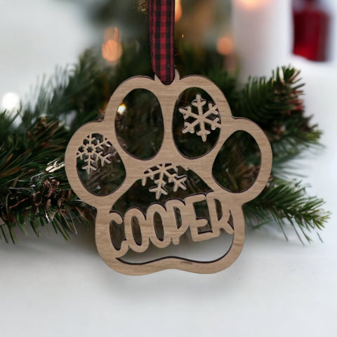 Capture your furry friend's spirit with the Dog Paw Print Personalized Ornament. Add a custom touch by imprinting your dog's name, creating a heartfelt keepsake for your holiday celebrations