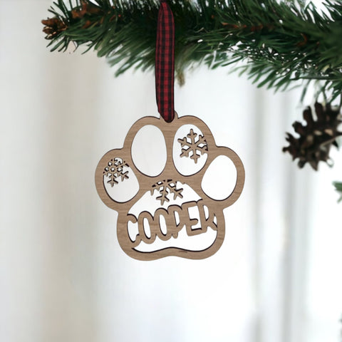 Capture your furry friend's spirit with the Dog Paw Print Personalized Ornament. Add a custom touch by imprinting your dog's name, creating a heartfelt keepsake for your holiday celebrations