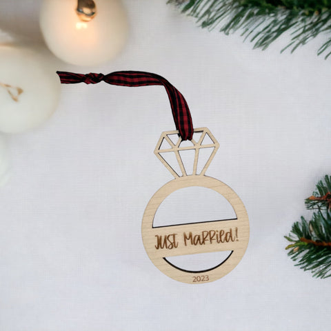 Just Married Ornament - Celebrate the newlywed bliss with this charming decoration, featuring a whimsical design. A perfect addition to your holiday decor, capturing the joy and love of the recent union.