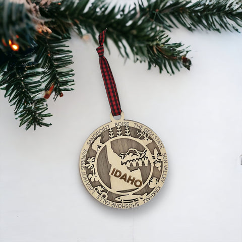 Adorn your tree with the charm of Idaho! Our Idaho State Highlights Ornament showcases the beauty of the Gem State. From rugged mountains to scenic landscapes, celebrate the spirit of Idaho in every detail.