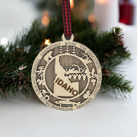 Adorn your tree with the charm of Idaho! Our Idaho State Highlights Ornament showcases the beauty of the Gem State. From rugged mountains to scenic landscapes, celebrate the spirit of Idaho in every detail.