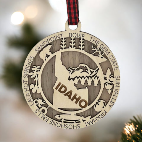 Adorn your tree with the charm of Idaho! Our Idaho State Highlights Ornament showcases the beauty of the Gem State. From rugged mountains to scenic landscapes, celebrate the spirit of Idaho in every detail.