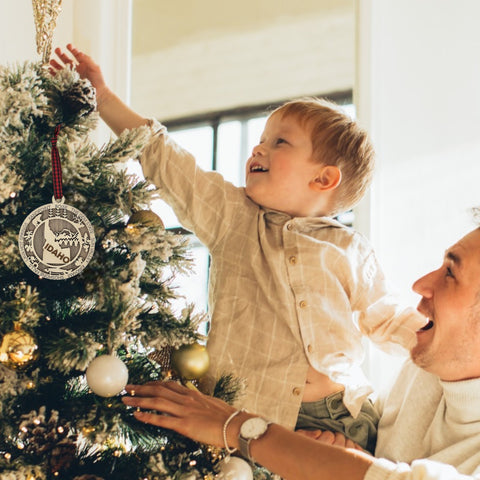 Adorn your tree with the charm of Idaho! Our Idaho State Highlights Ornament showcases the beauty of the Gem State. From rugged mountains to scenic landscapes, celebrate the spirit of Idaho in every detail.