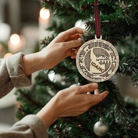 Adorn your tree with the charm of Idaho! Our Idaho State Highlights Ornament showcases the beauty of the Gem State. From rugged mountains to scenic landscapes, celebrate the spirit of Idaho in every detail.