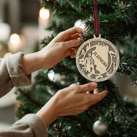 Elevate your holiday with the essence of Illinois! Our State Highlights Ornament captures the iconic landmarks and spirit of the Prairie State. Bring a touch of Illinois charm to your festive decor.