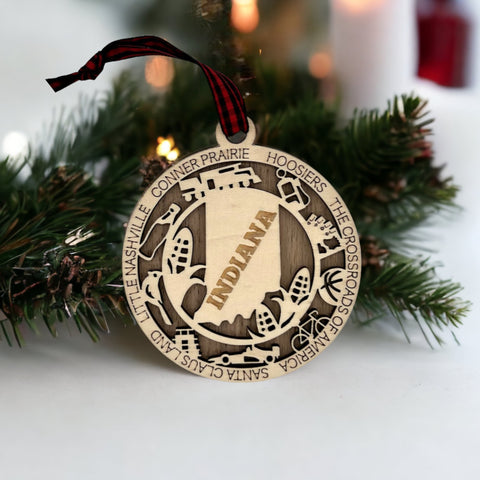 Deck the halls with Hoosier pride! Introducing our Indiana State Highlights Ornament, a perfect blend of charm and tradition. Celebrate the beauty of the Crossroads of America in every detail. 