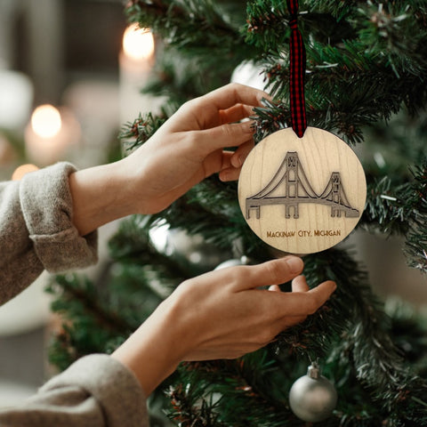 Iconic Mackinac Bridge ornament, featuring the breathtaking steel spans connecting Michigan's Upper and Lower Peninsulas. A majestic addition to your holiday decor, capturing the spirit of this engineering marvel and the beauty of the Great Lakes region