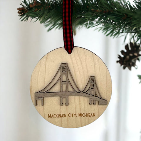 Iconic Mackinac Bridge ornament, featuring the breathtaking steel spans connecting Michigan's Upper and Lower Peninsulas. A majestic addition to your holiday decor, capturing the spirit of this engineering marvel and the beauty of the Great Lakes region