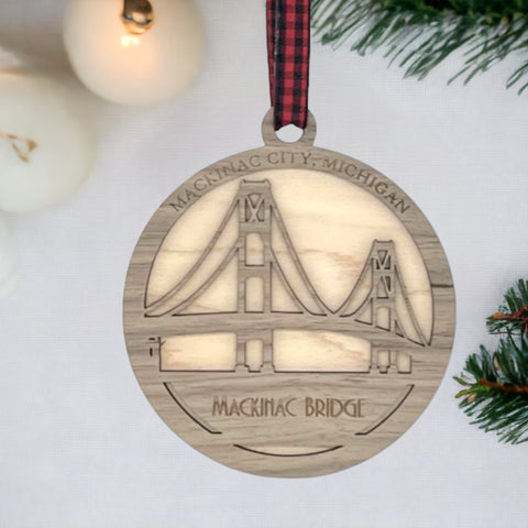 Iconic Mackinac Bridge ornament, featuring the breathtaking steel spans connecting Michigan's Upper and Lower Peninsulas. A majestic addition to your holiday decor, capturing the spirit of this engineering marvel and the beauty of the Great Lakes region.