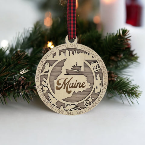 Elevate your holiday with a touch of Maine magic! Introducing our Maine State Highlights Ornament, a coastal-inspired masterpiece. From lighthouses to pine-covered landscapes, celebrate the beauty of the Pine Tree State in every detail. 