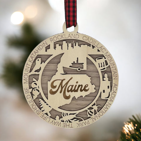 Elevate your holiday with a touch of Maine magic! Introducing our Maine State Highlights Ornament, a coastal-inspired masterpiece. From lighthouses to pine-covered landscapes, celebrate the beauty of the Pine Tree State in every detail. 