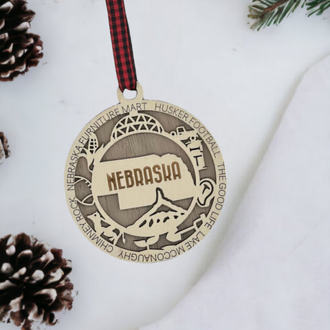 Deck your tree with a dash of Cornhusker pride! Our Nebraska State Highlights Ornament celebrates iconic moments in the heart of the Midwest.