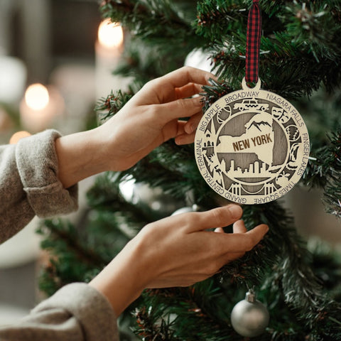 Capture the Empire State's magic with our New York State Highlights Ornament! A miniature masterpiece featuring iconic landmarks and vibrant scenes. Elevate your holiday décor with a touch of New York charm.
