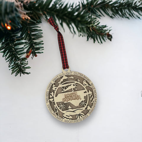 Dazzle your tree with Southern charm! Introducing the North Carolina State Highlights Ornament – a delightful keepsake showcasing the beauty of the Tar Heel State. 