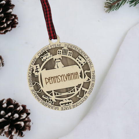 Keystone State charisma for your tree! Introducing the Pennsylvania State Highlights Ornament—a miniature masterpiece celebrating history and hometown pride. Elevate your holiday decor with a touch of Pennsylvania charm.