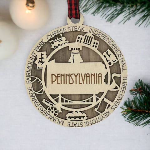 Keystone State charisma for your tree! Introducing the Pennsylvania State Highlights Ornament—a miniature masterpiece celebrating history and hometown pride. Elevate your holiday decor with a touch of Pennsylvania charm.